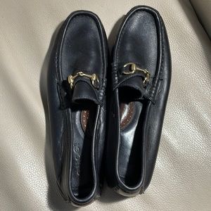Gucci- gently worn leather driving shoe.